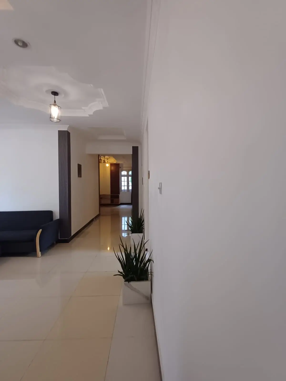 Hallway leading to the guest rooms at Scuba Haven guesthouse, Fuvahmulah